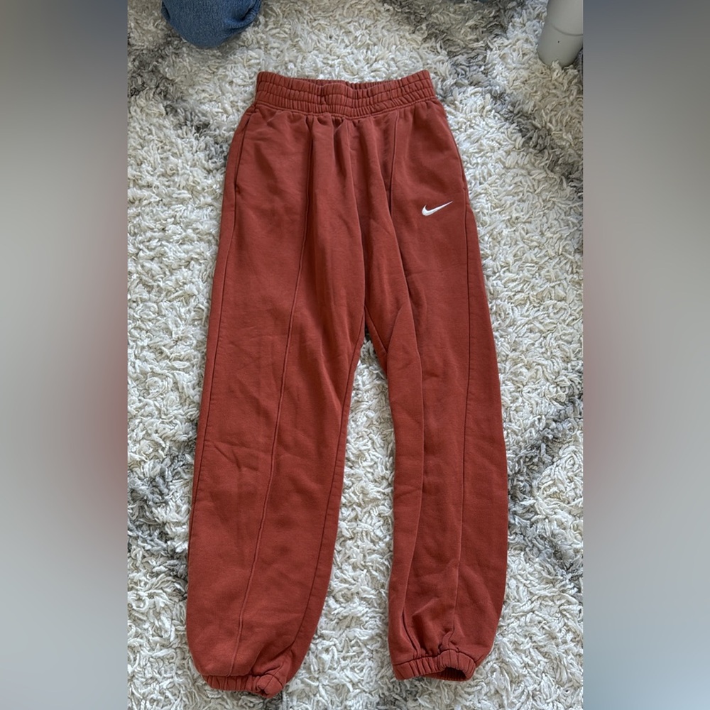 Orange Nike sweatpants